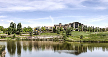 a modern building beside a lake